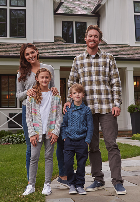 Family in front of house